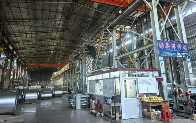 Yueyang Technology coating line with Yueyang factory signage in Bazhou plant
