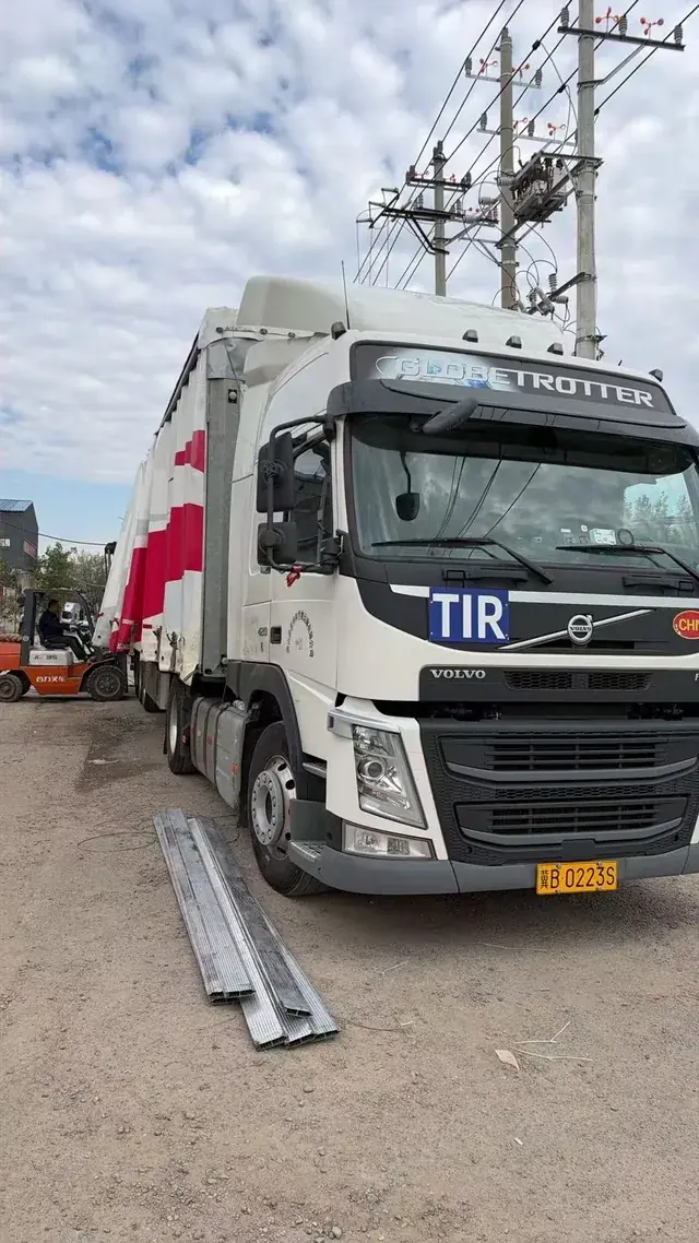 TIR truck loading writing-surface coils at the Yueyang plant