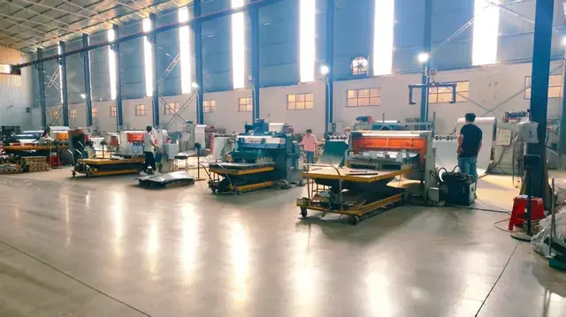 Slitting and shearing line cutting coated steel to customer widths